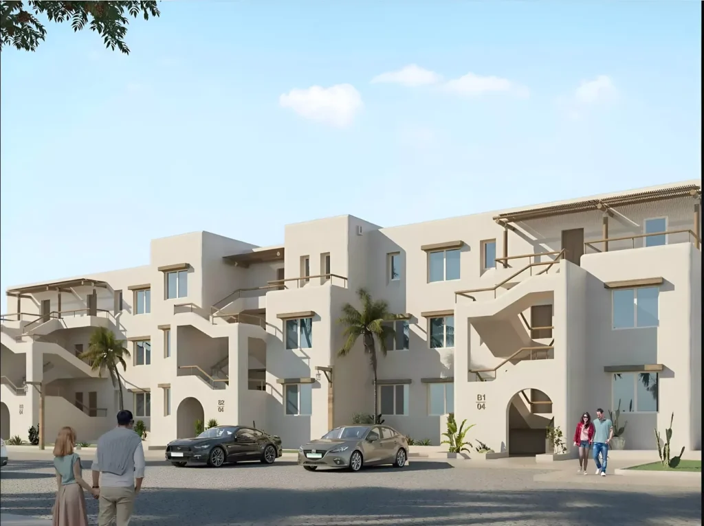 مبنى شاليهات بأدراج خارجية وأشجار نخيل في هاسيندا ويست الساحل الشمالي